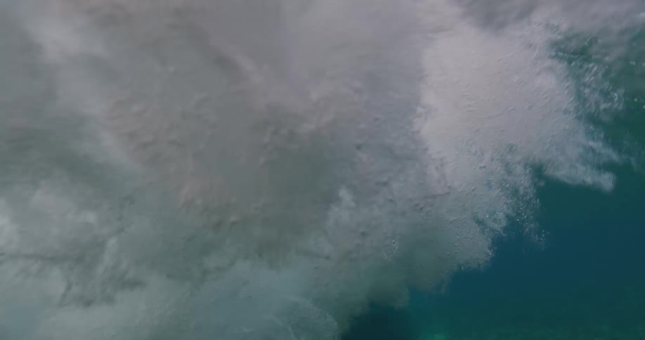 A large wave crashes to the bottom of the ocean