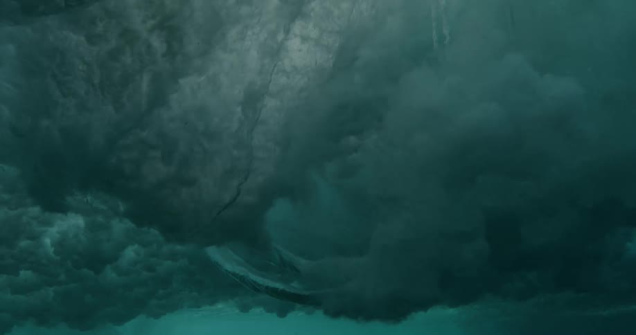 Ocean waves breaking against the shore seen from underwater