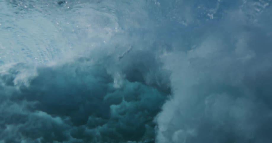 Close up shot of a wave and the foam and bubbles