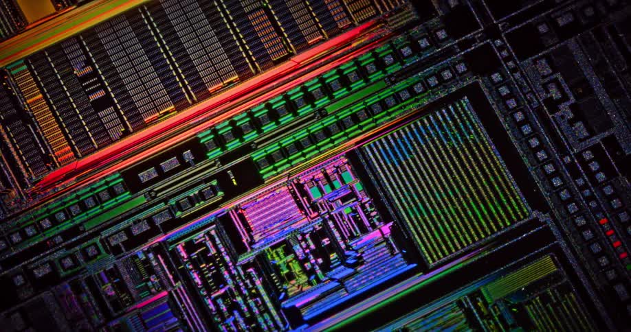 Colorful lights flow across digital schematic turning gray lines colorful