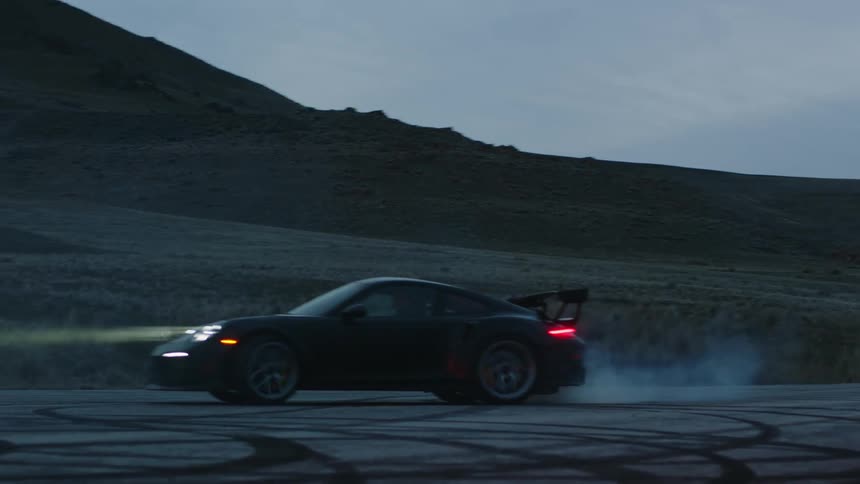 A person in a sports car spins circles