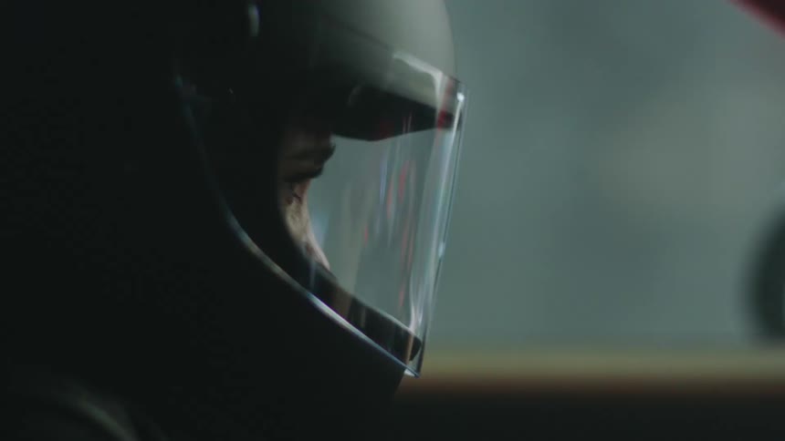 A woman wears a helmet while driving
