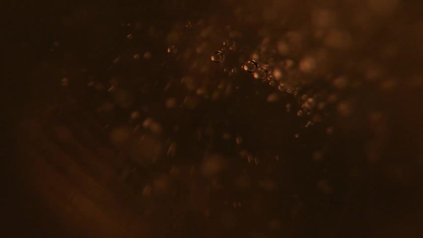 Close up of yellow liquid with bubbles