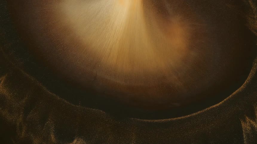 Bright center portion of sandy mixture darkens as it spreadspushing striated layer outward
