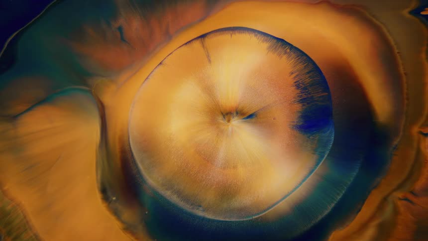 Abstract golden wave spreads across the surface in circular shape