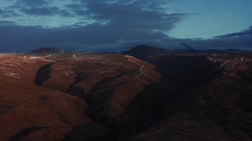 An aerial view of snowy terrain in nature