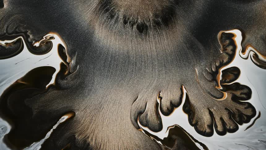 Flowing glittery brown and white liquid