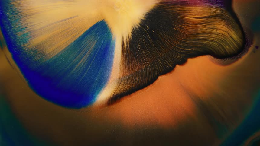 An explosion of metallic particles from the top of the camera