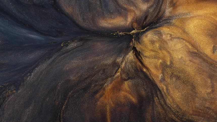 Close up of abstract glittering sand flowing