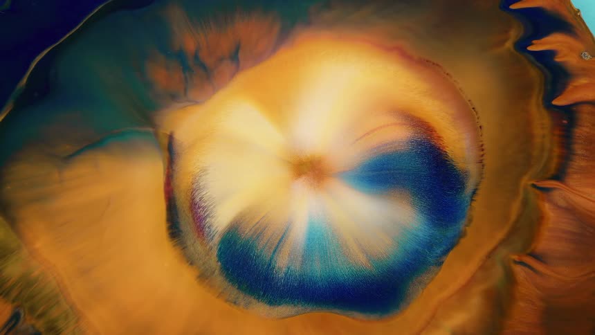 Golden and blue substance expanding