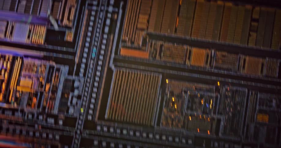 Dark backgrounded digital circuit board shines with bright colors