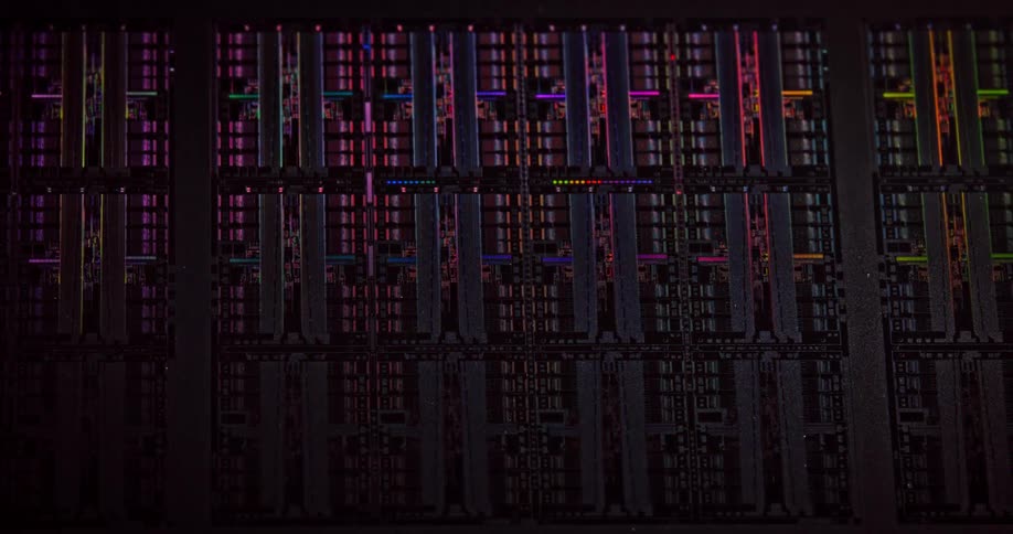Vivid multi colored lights flow across circuitry lines