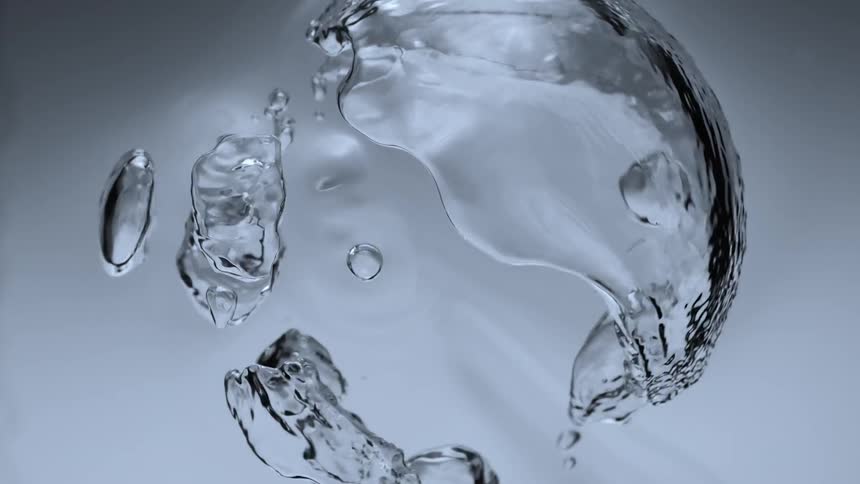 a bubble floats in the water and spreads into smaller bubbles