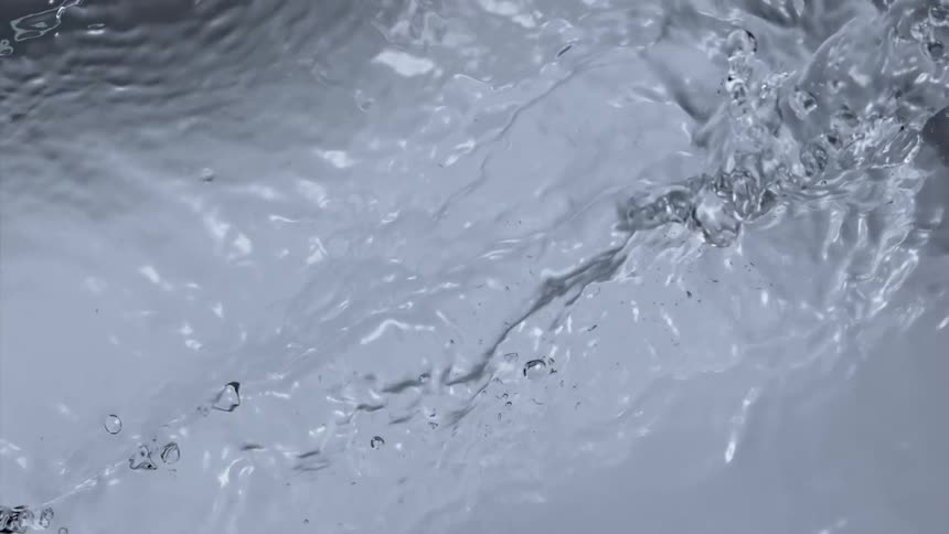 A stream of water splashes upward and out