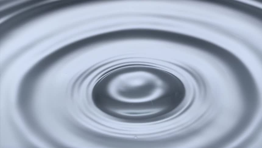 a perfect water drop splashes on the surface