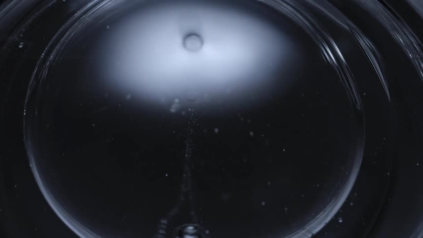 Rings in water ripple and reflect light as they expand