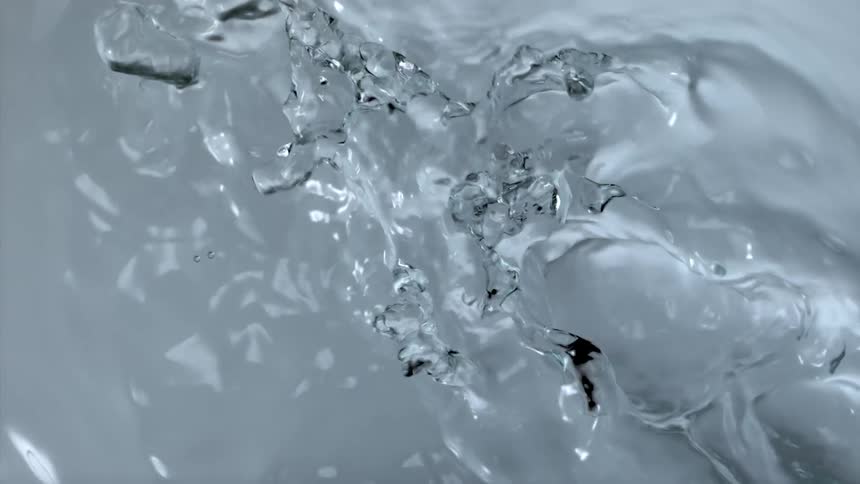 Water moves and splashes as bubbles rise to the top
