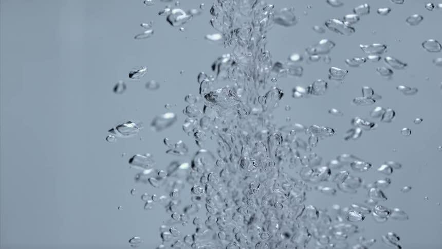 Water poured into water sends air bubbles floating up