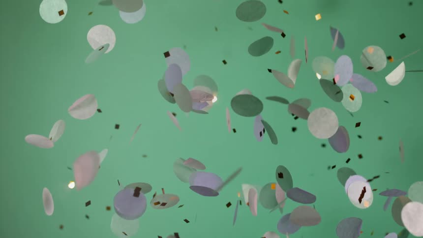 Confetti composed of circular paper pieces and metallic squares fall against a pale green background