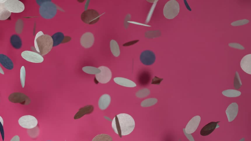 Circular flat objects are floating and spinning through the air casting shadows