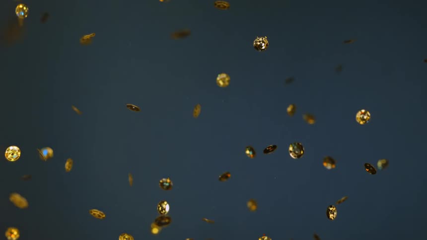 Hundreds of gold coins spin in the air like confetti