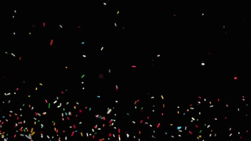 Abstract footage of sprinkles falling in the air