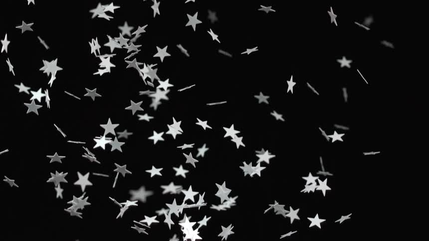 Star shaped confetti falls through the air