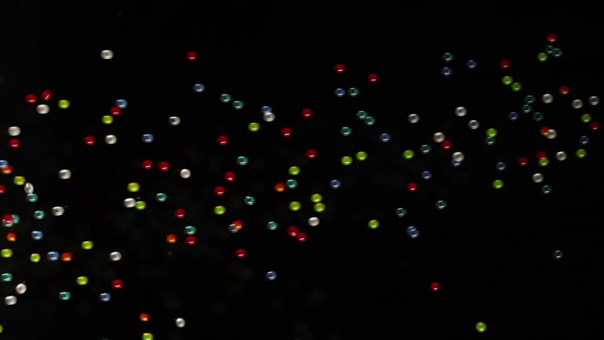 Surreal footage of balls floating and moving in the air