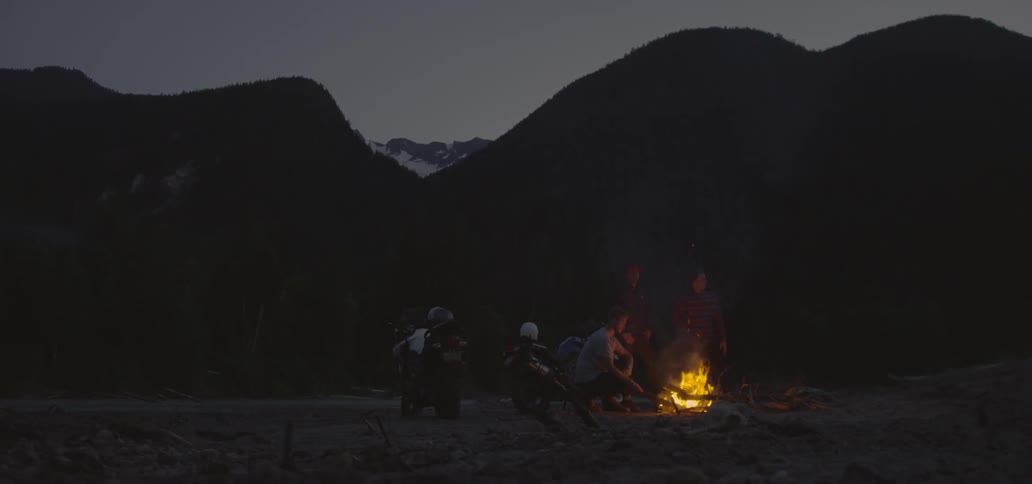 People are gathered around a campfire