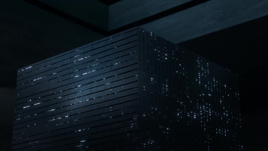 Data is flashing across the surface of a supercomputer cube in a dark room