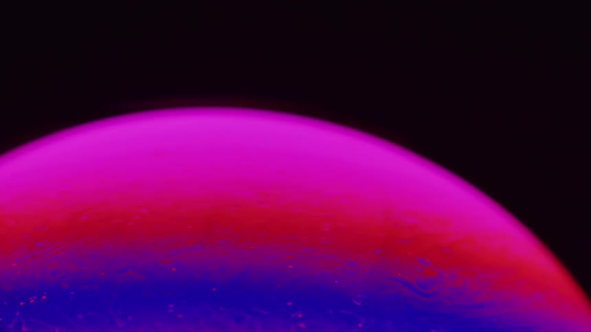 Close up of colorful sphere spining around