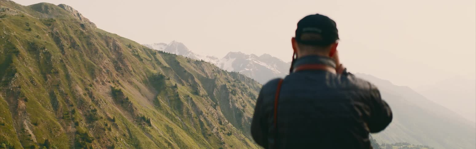 Man taking a photo of a range