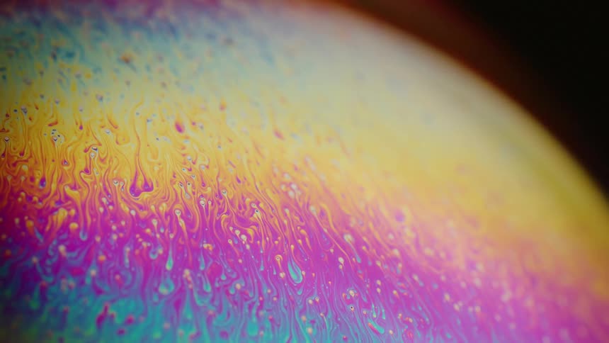 A colorful rainbow painted globe