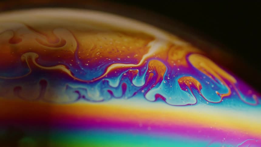 The rainbow liquid swirls around