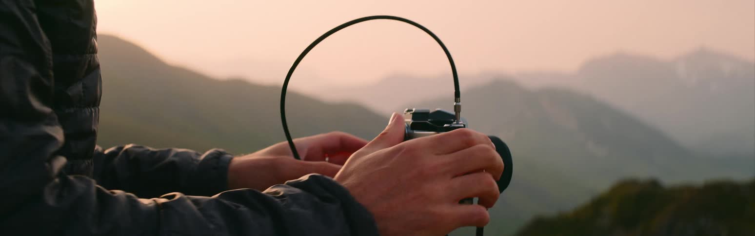 A photographer working with a camera on a tripod