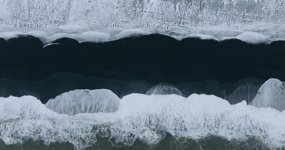 The waves crash on the shore
