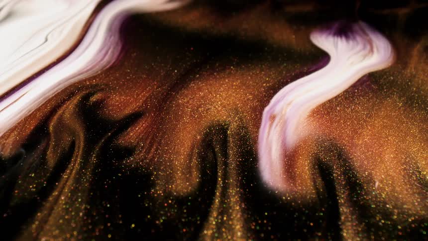 The glitter moves around in the air in swirls