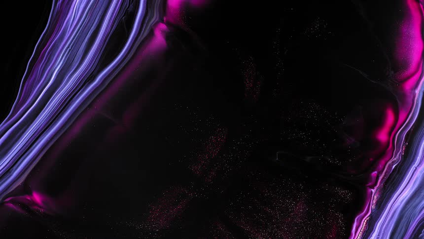 Colored material spreads apart to reveal a darker color in between