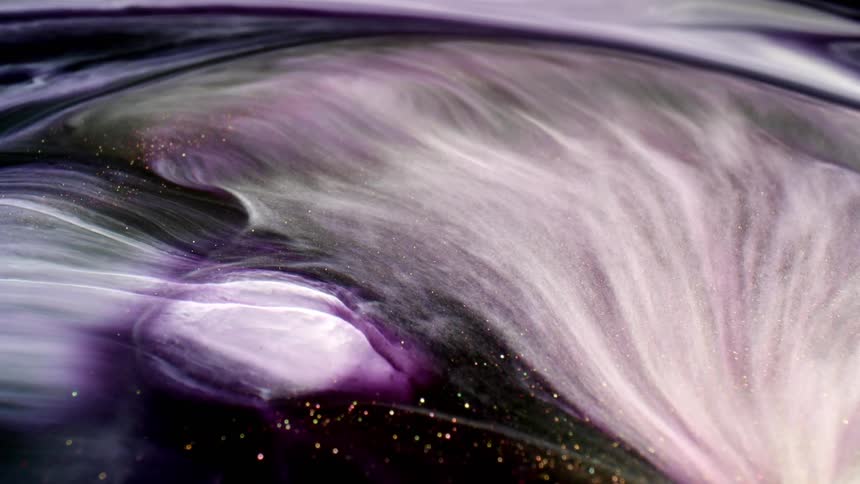 Waves of white glitter in a dark medium