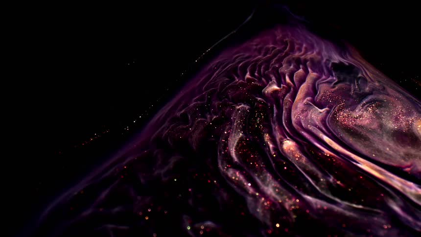 Various colors of glitter and paint swirl together