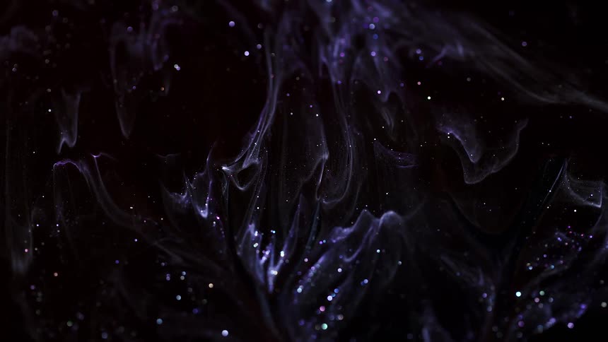 Sparkling lights and glitter flow in a sea of black