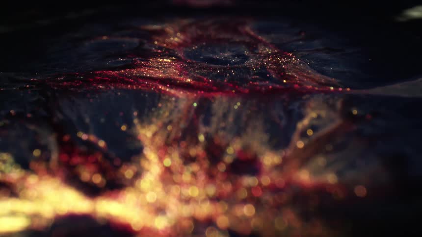 Black gold and red colors shimmer and move like oil