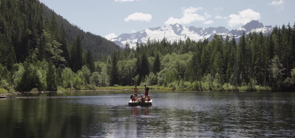 People are on canoes in a lake