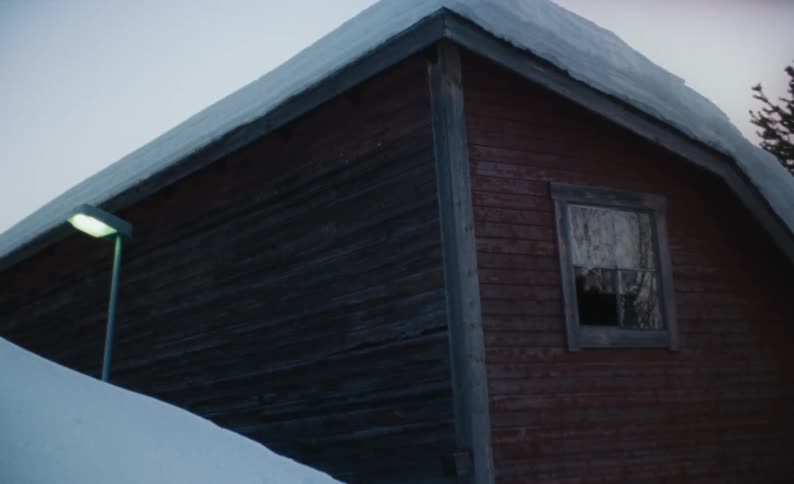 A snow covered home in a rural area