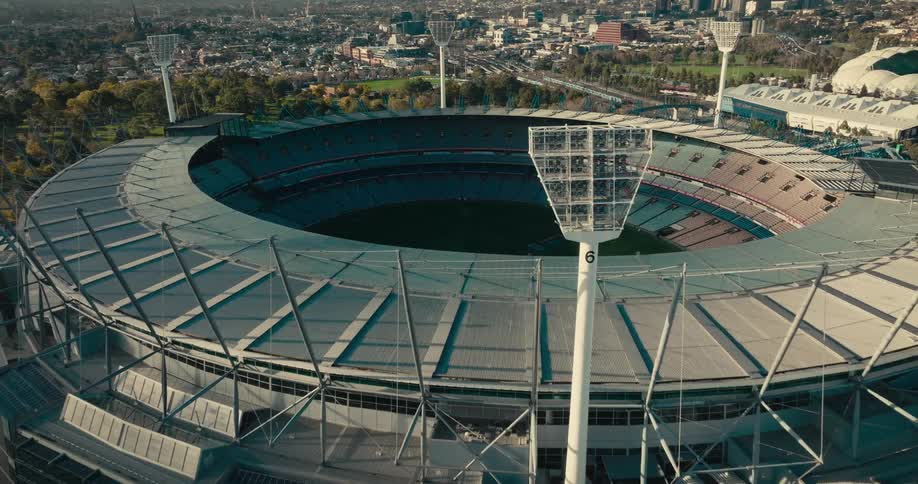 Aerial view of a sports arena on a city at daytime