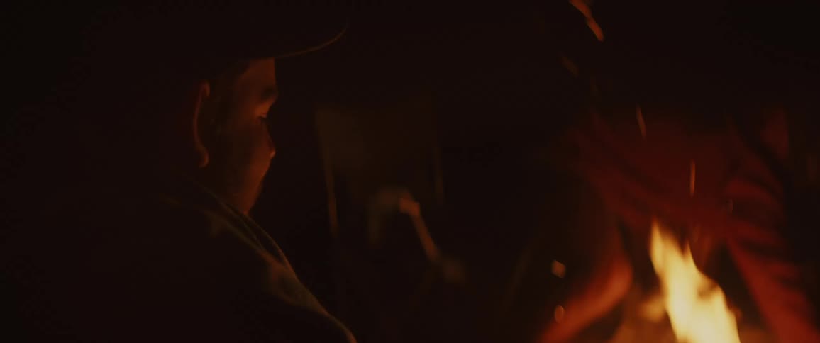 People sitting around a campfire