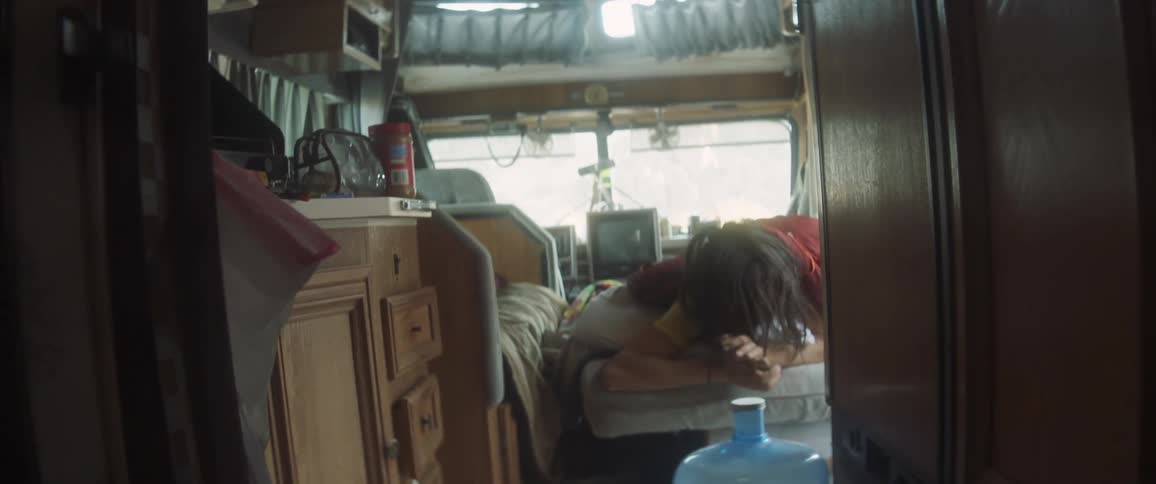 Woman waking up in a rv