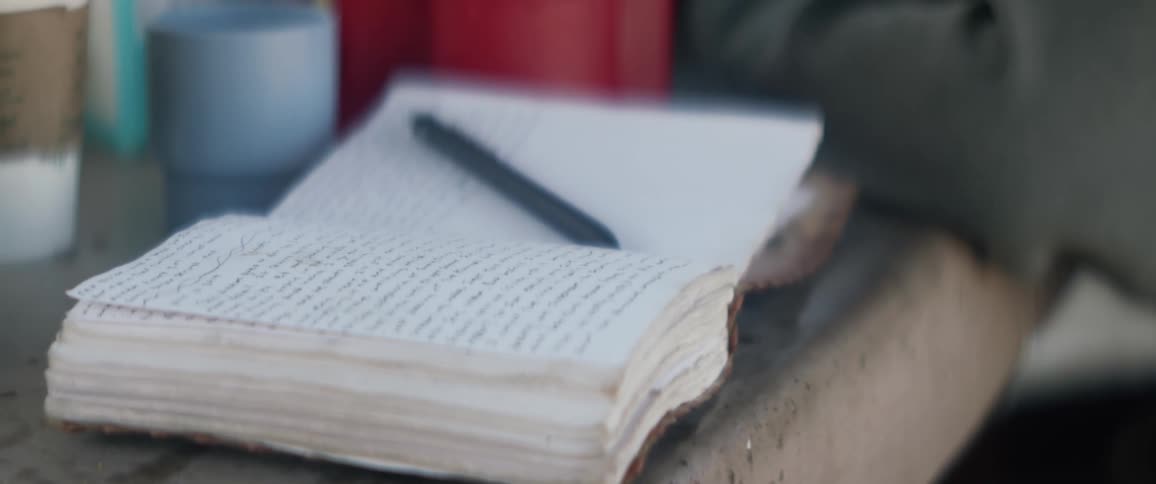 A person sits by his notebook