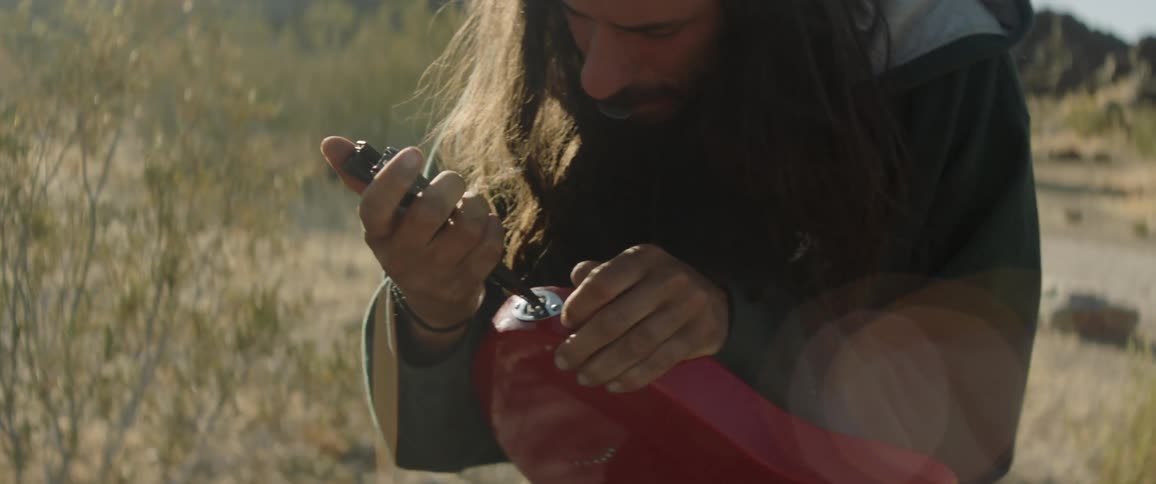 Man operating on the amp port of the guitar