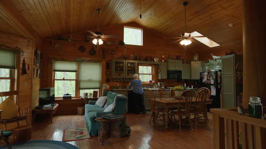 A woman is cooking in her kitchen